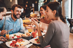 Group of friends eating in a restaurant
