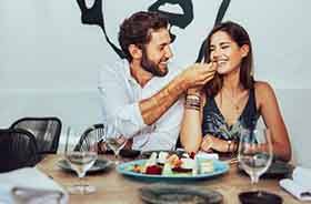 Young adult couple enjoying a romantic meal