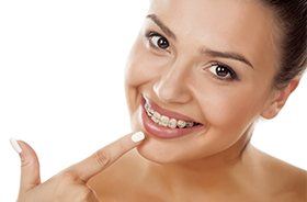 Woman pointing to clear braces