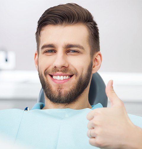 Smiling man in dental exam room