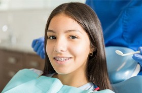 Smiling young patient with traditional braces in Hamden